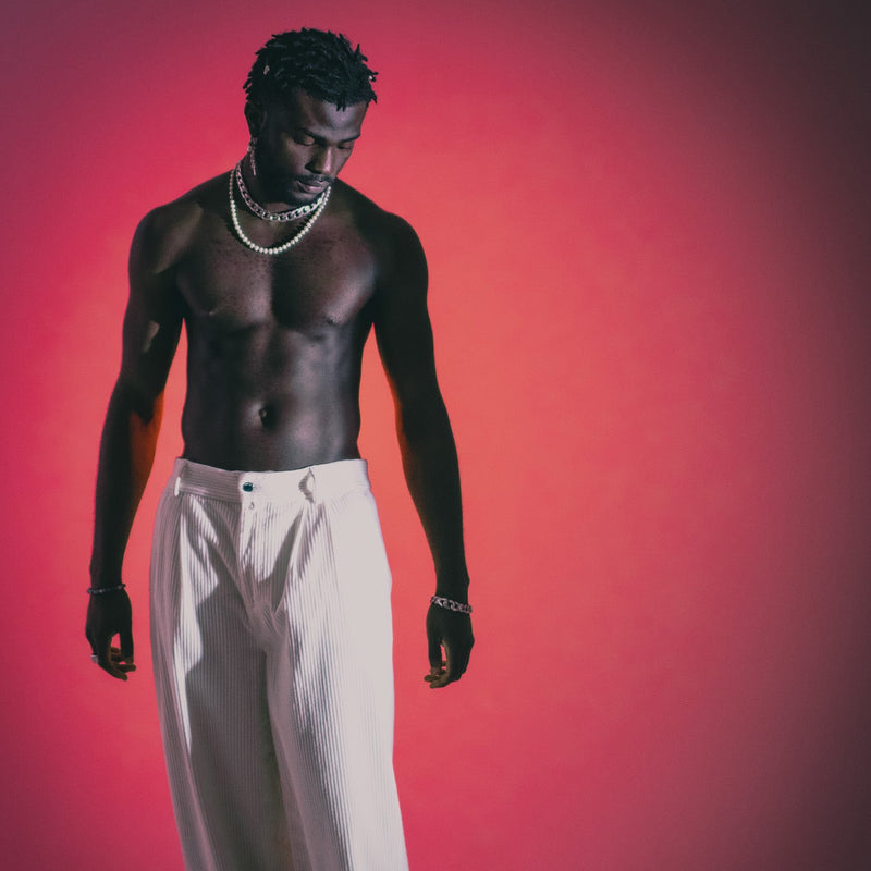 032c Brand Blog Image of a man in white trousers