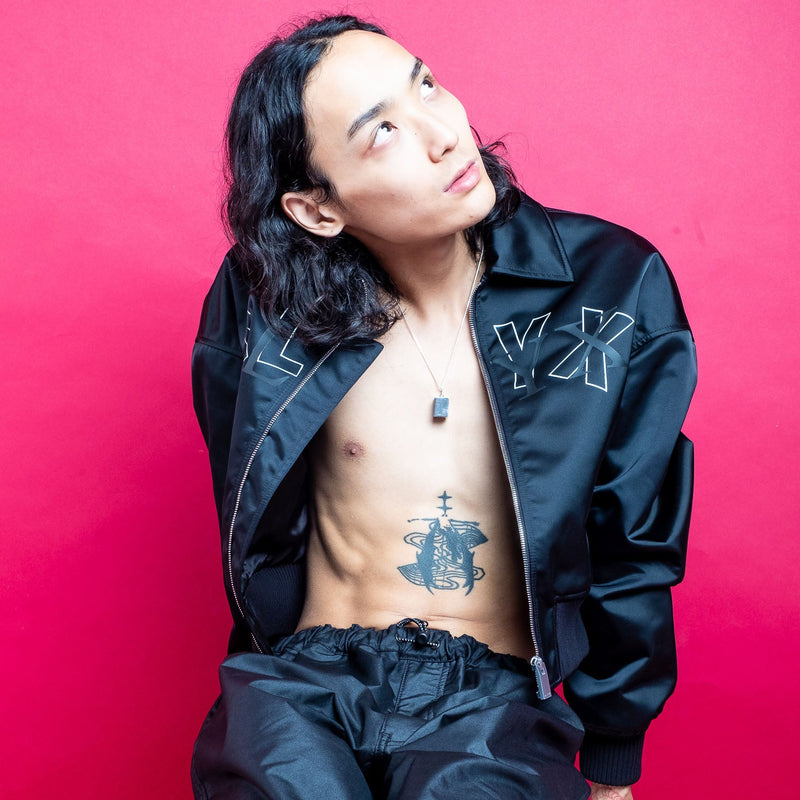 1017 Alyx 9SM_Blog_Banner Image of a model in a tracksuit