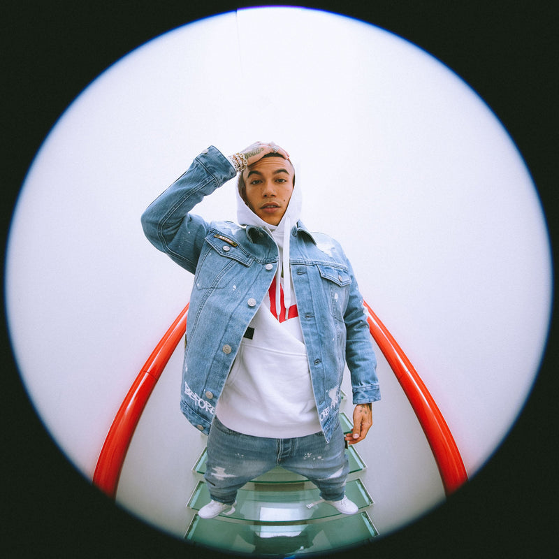 Evisu Blog Post Banner Image if a man wearing Denim Jacket with a white hoodie