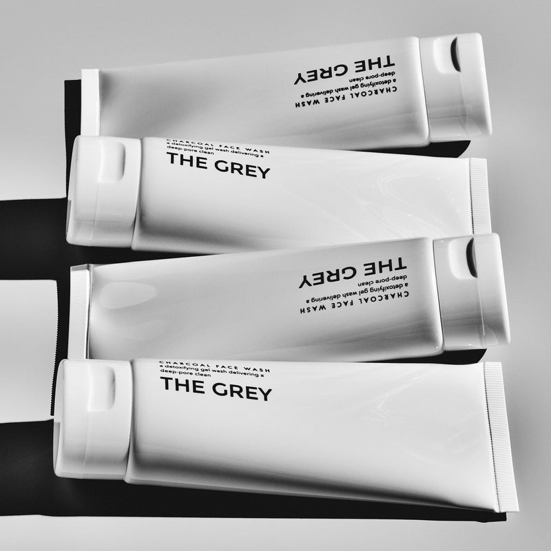 The Grey high quality cosmetics brand Banner image of face cream products displayed on a surface