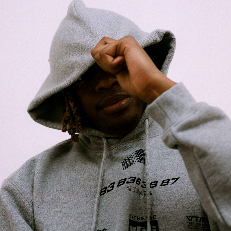 VTMNS brand Banner image of a person wearing a hoodie