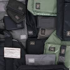 Porter Yoshida & Co. brand banner image of multiple bags displayed in a surface