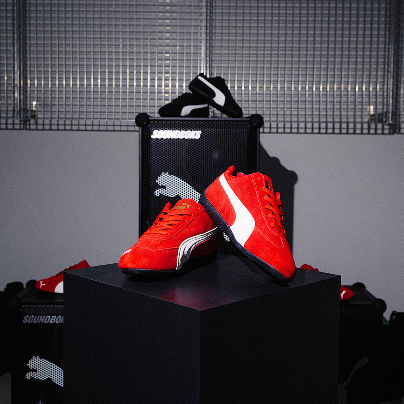 Red and Black Puma Speedcat Sneakers displayed in the Gate194 store