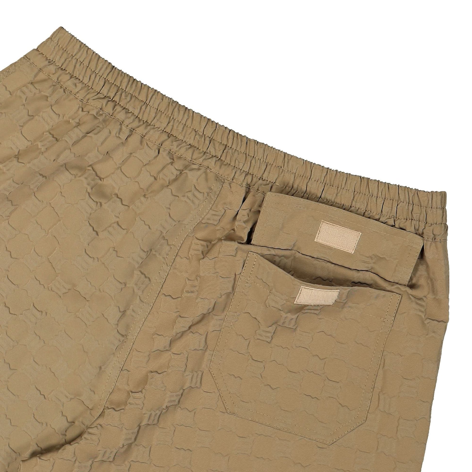 MISBHV Embossed Monogram Milano Tech Trousers Beige Detail view 5 | Gate