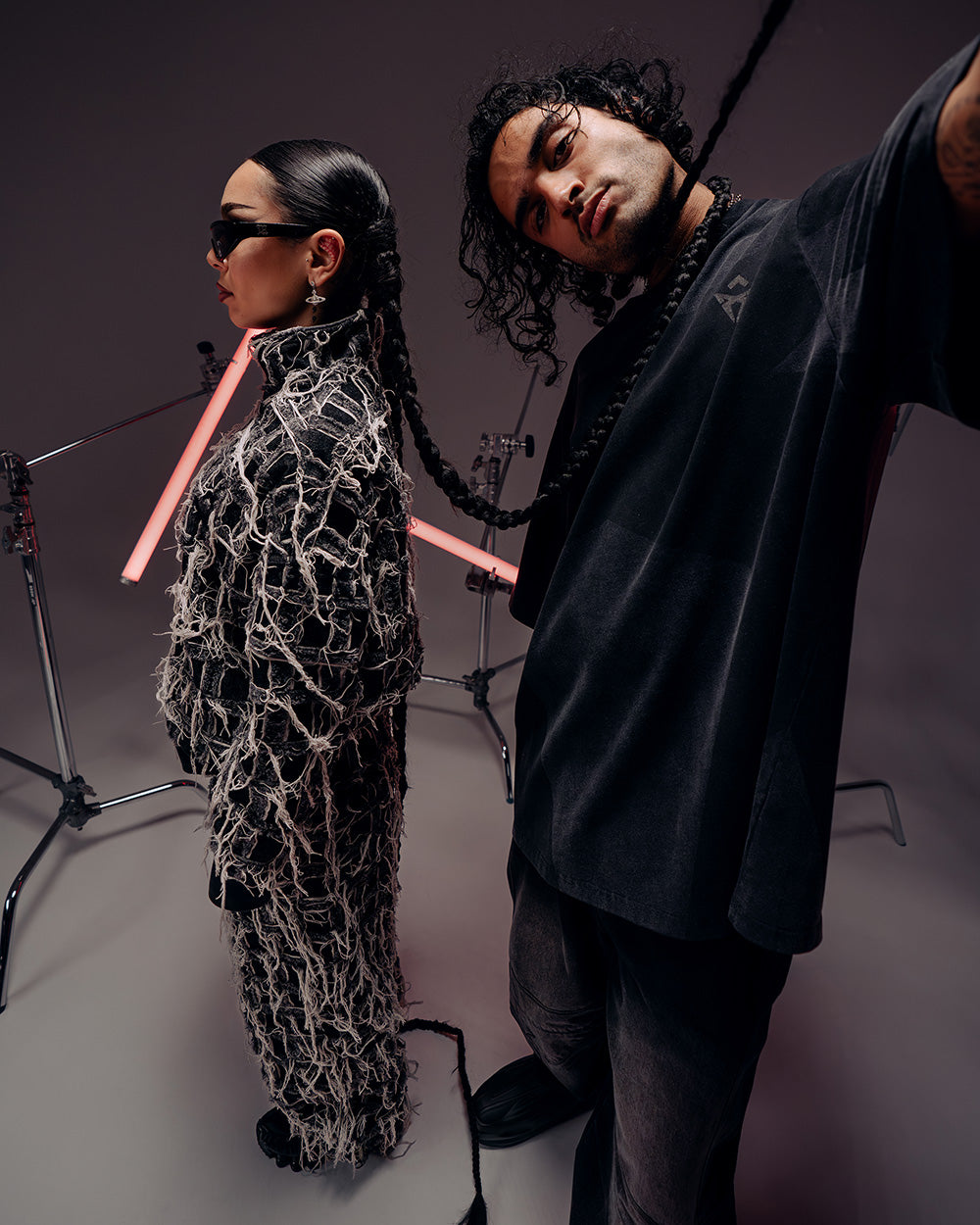 A male and female taking a selfie while wearing Gate X Cupra Anniversary capsule collection