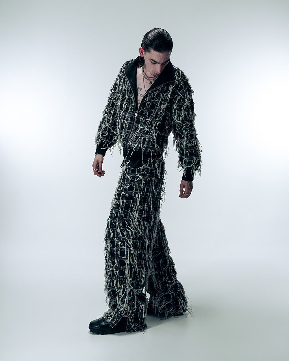 A man wearing Gate X Cupra Anniversary capsule collection denim set