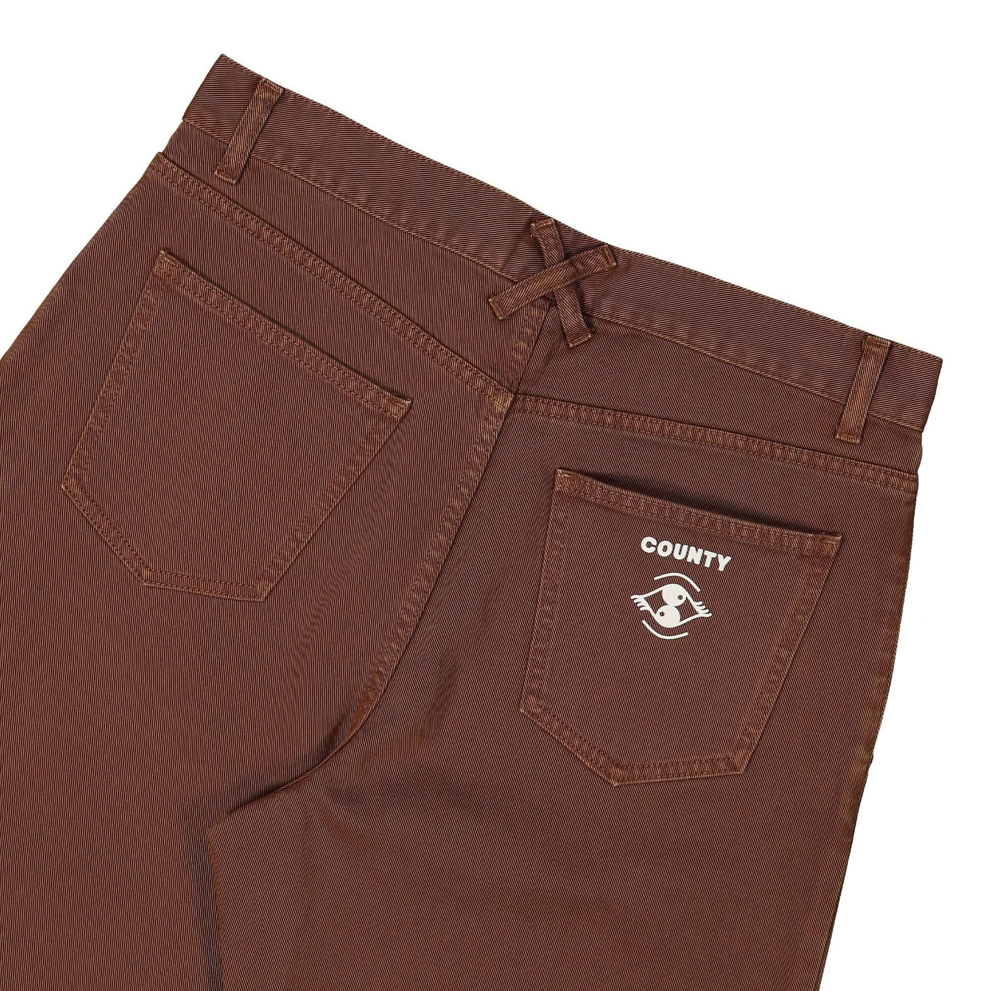 Marcelo Burlon - County of Milan Poster Eye Veg Dyed Flare Pants Brown Detail view 7 | Gate