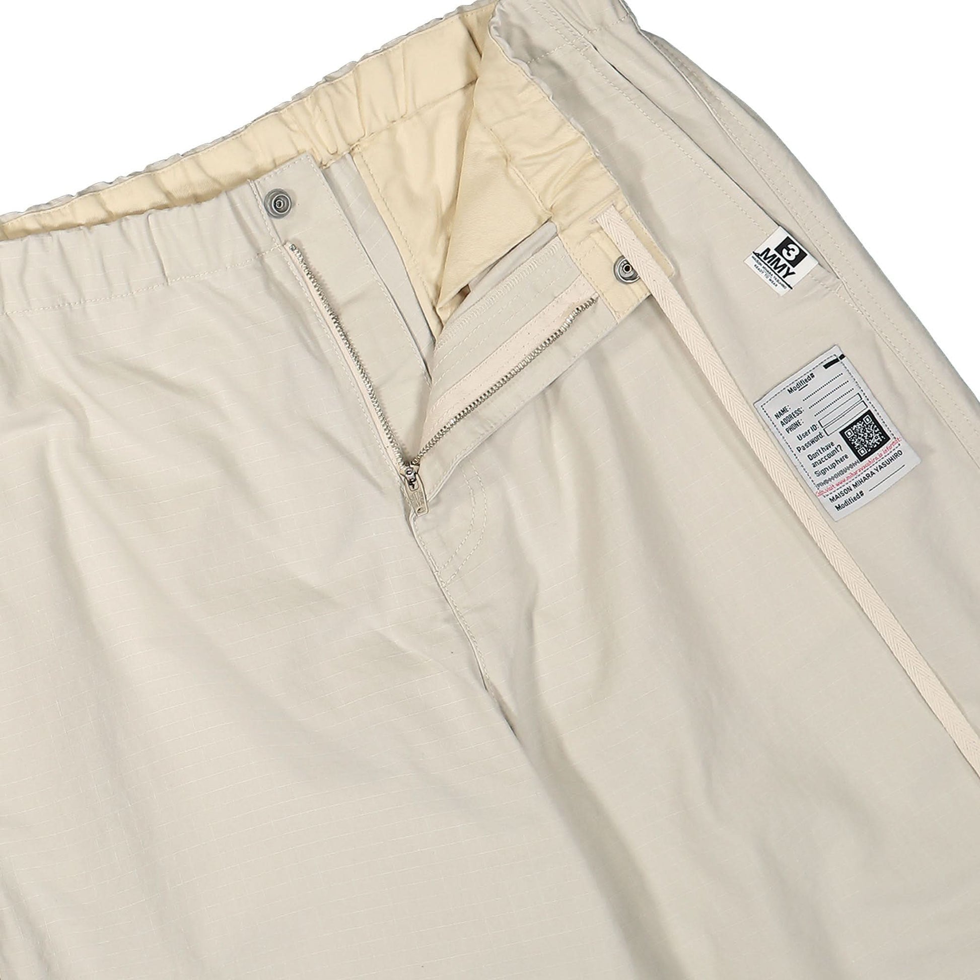 Maison Mihara Yasuhiro Ripstop Parachute Trousers Beige Detail view 4 | Gate
