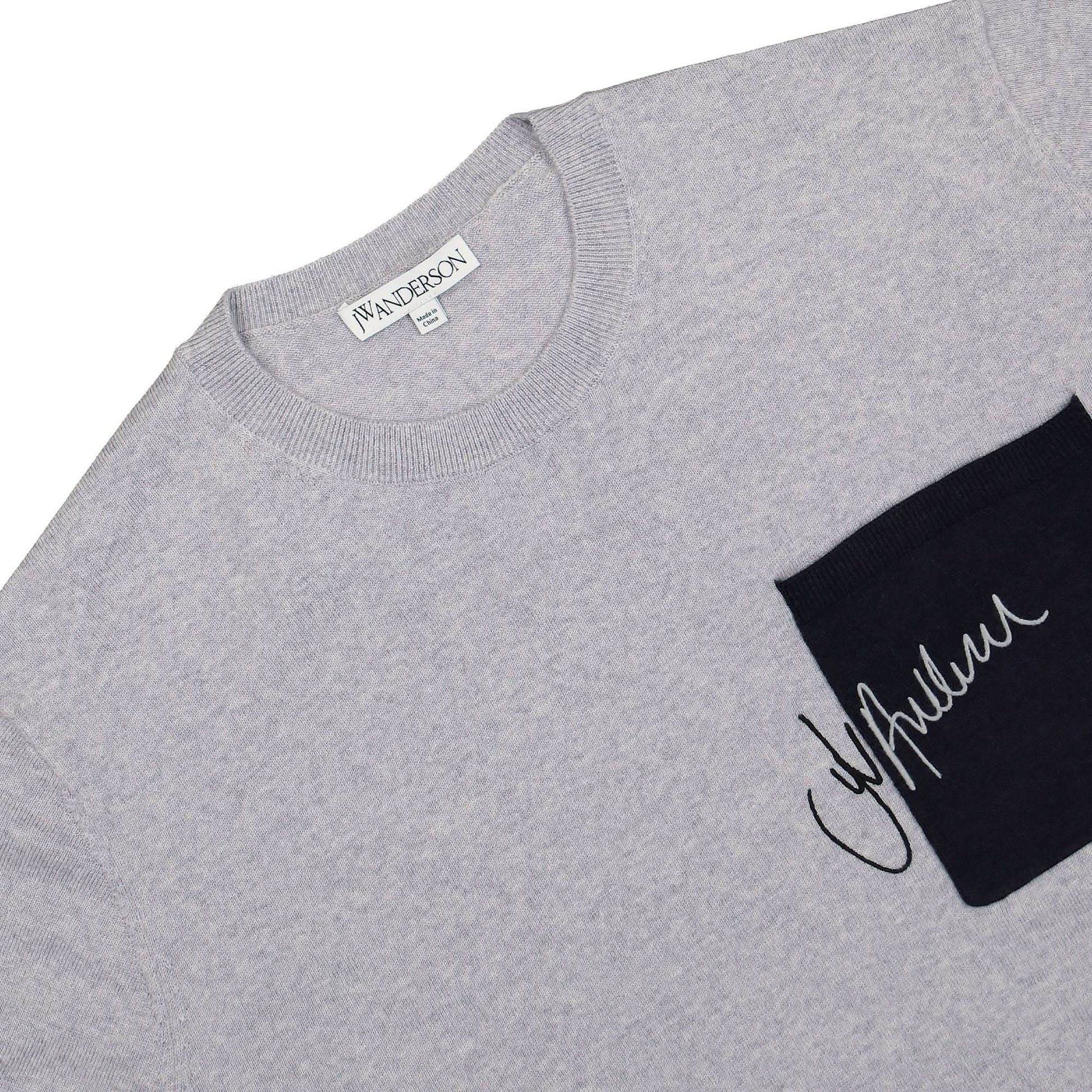JW Anderson Signature Pocket Crewneck Jumper Grey Detail view 3 | Gate
