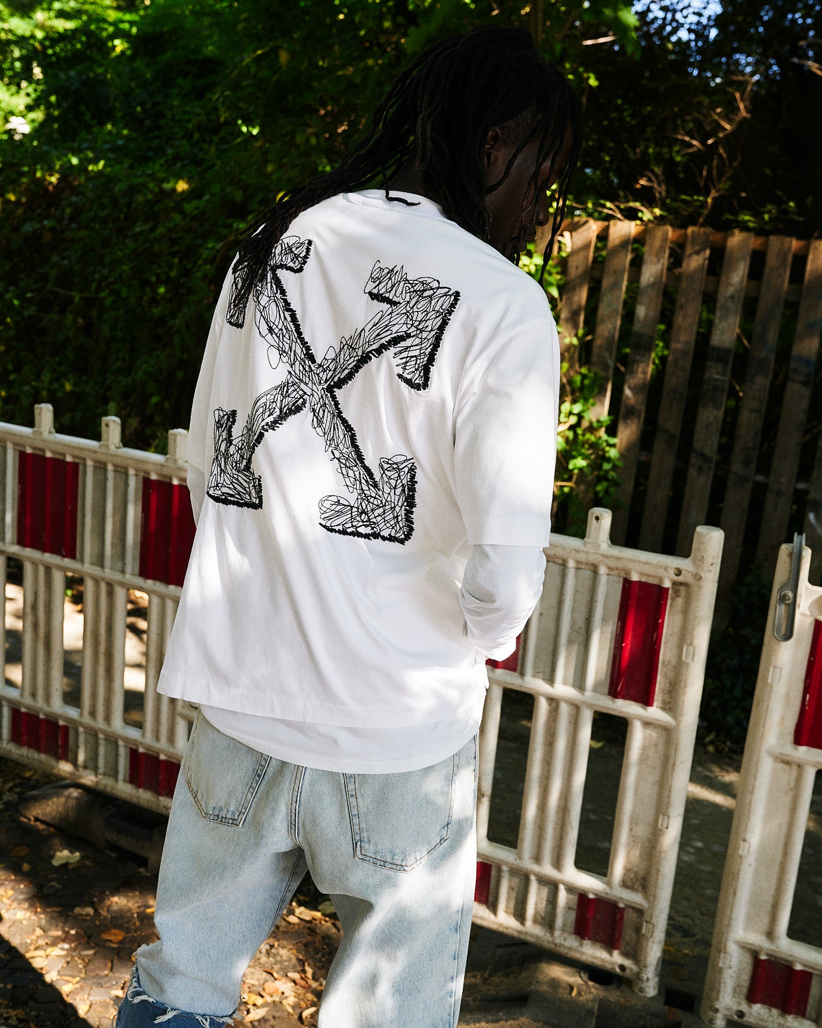 Off-White Scribble Arrow Skate S/S Tee White T-Shirts OMAA120F25JER00C0110 On Model Back View | GATE