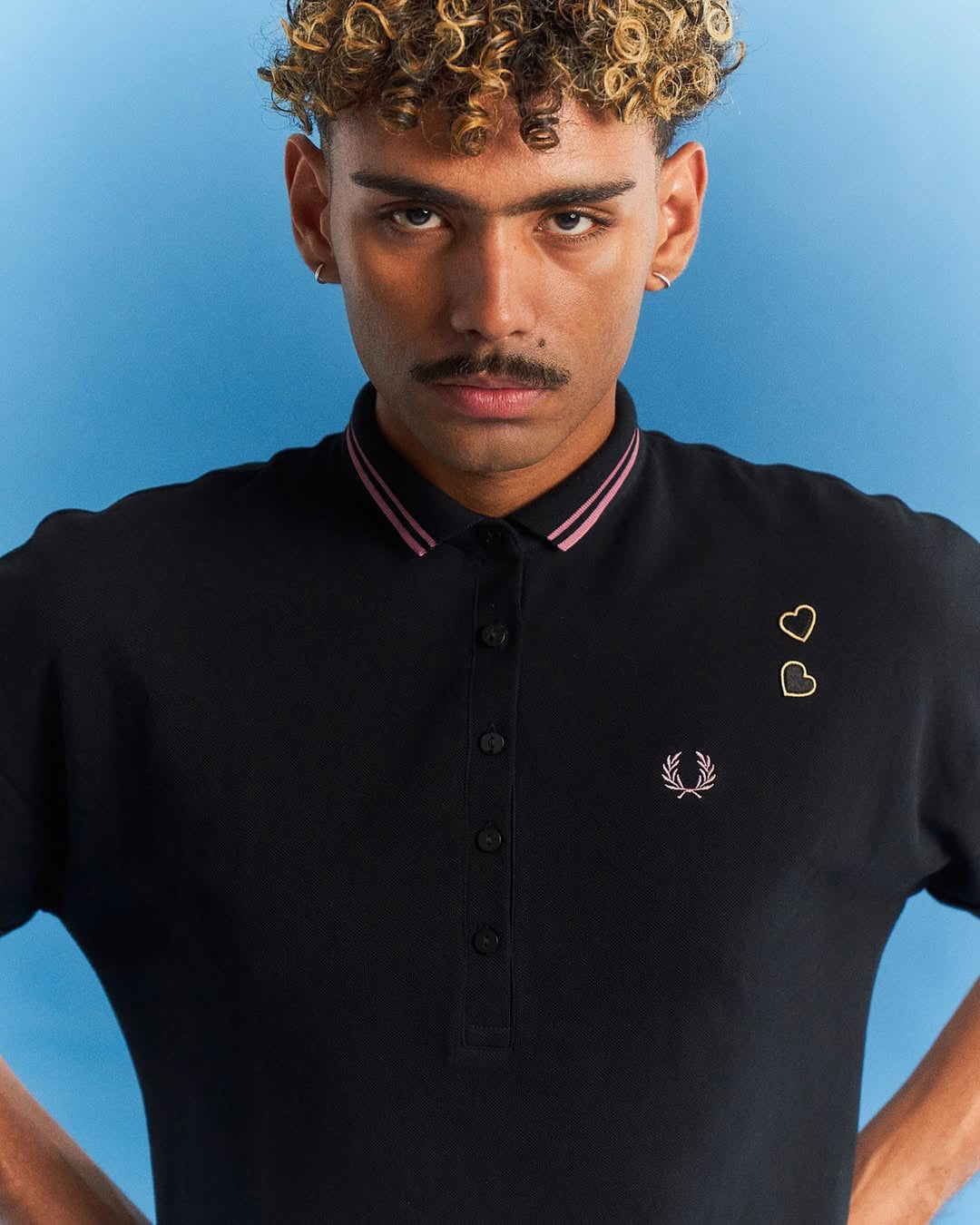 Freshman in a polo shirt by Gate