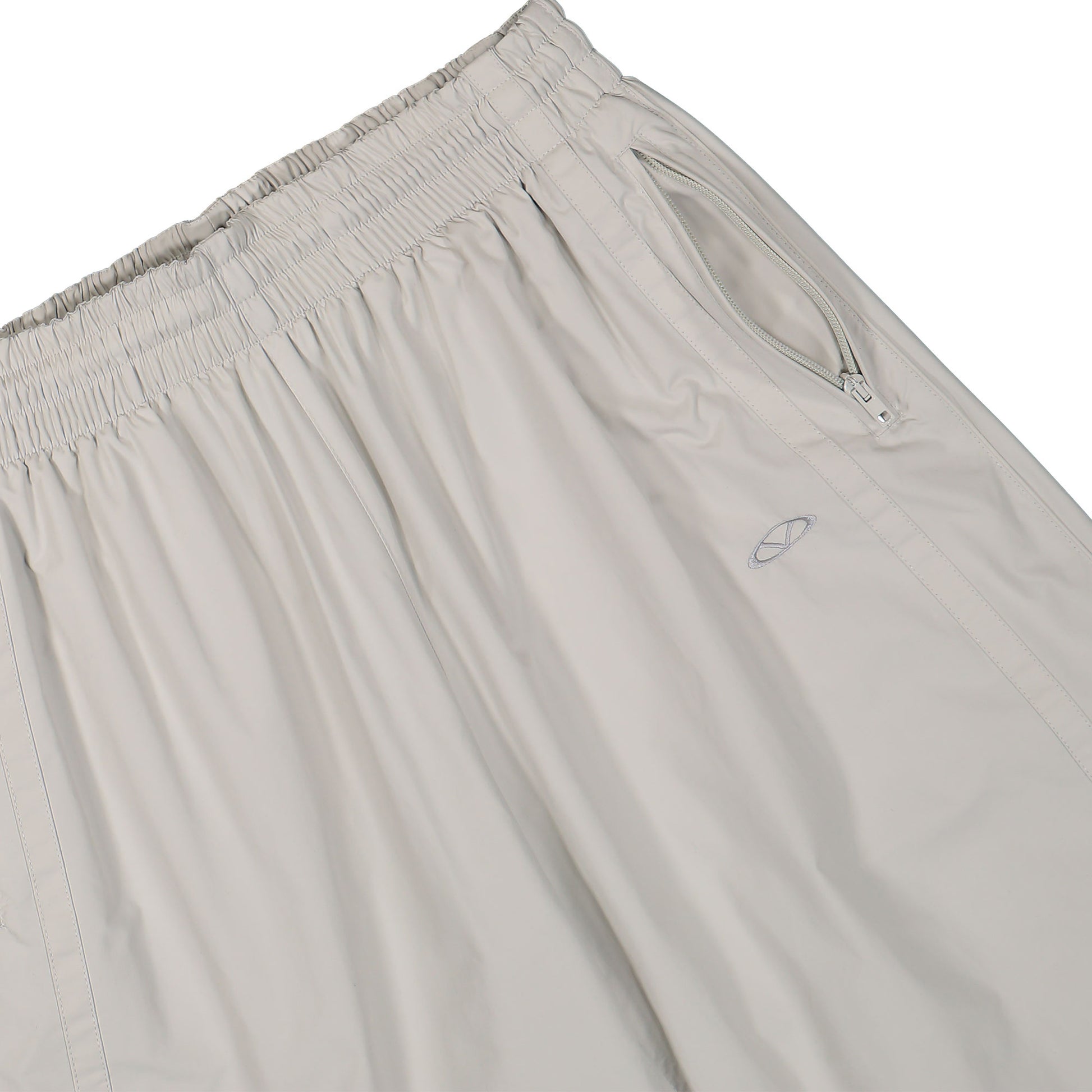 VETEMENTS Oval Logo Tracksuit Pants Beige Detail view 4 | Gate
