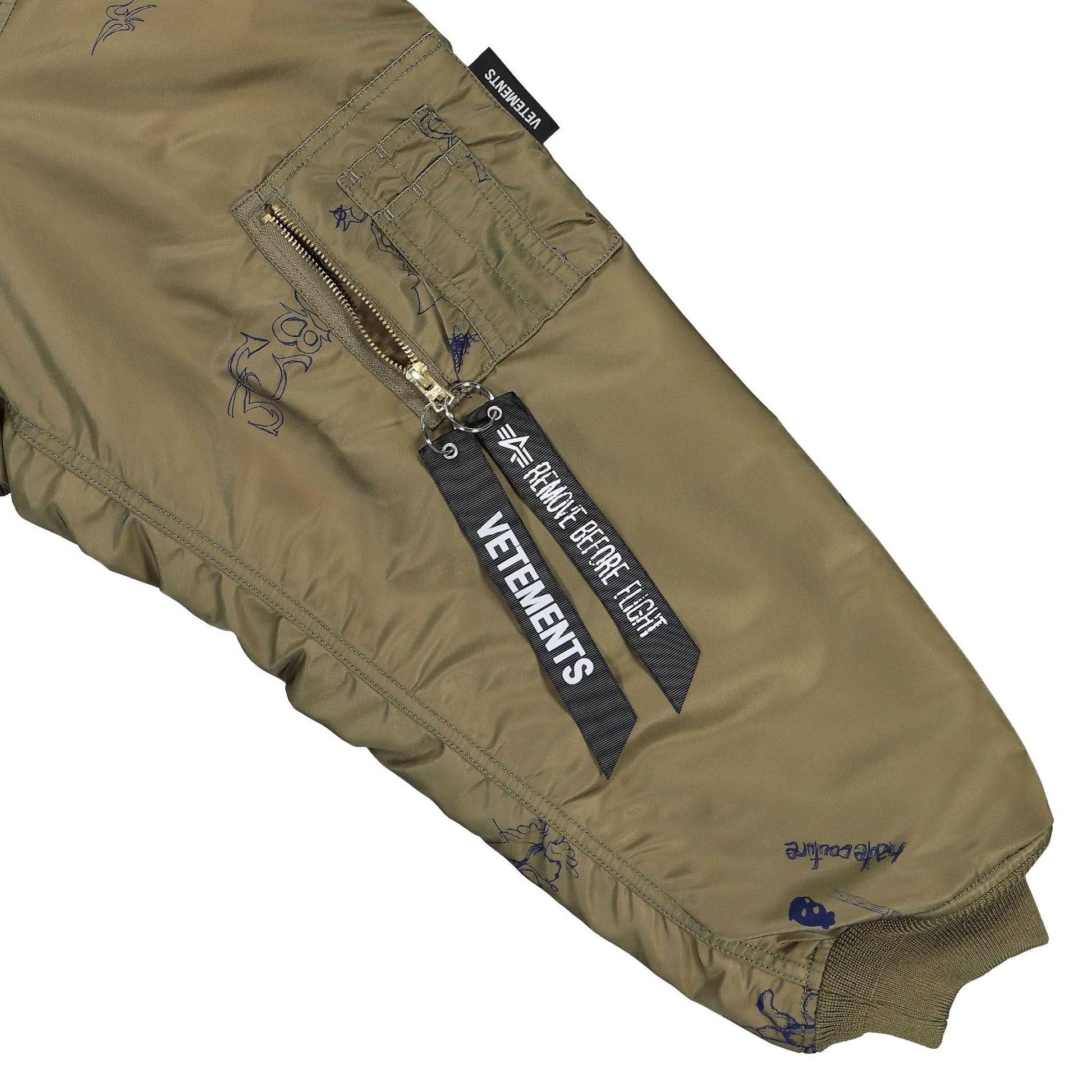 VETEMENTS Scribbled Hooded Bomber Jacket Olive Detail view 6 | Gate