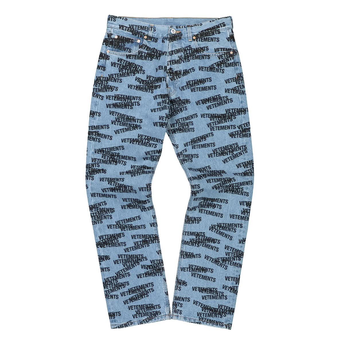 VETEMENTS Stamped Logo Straight Leg Denim Jeans Blue Detail view 1 | Gate