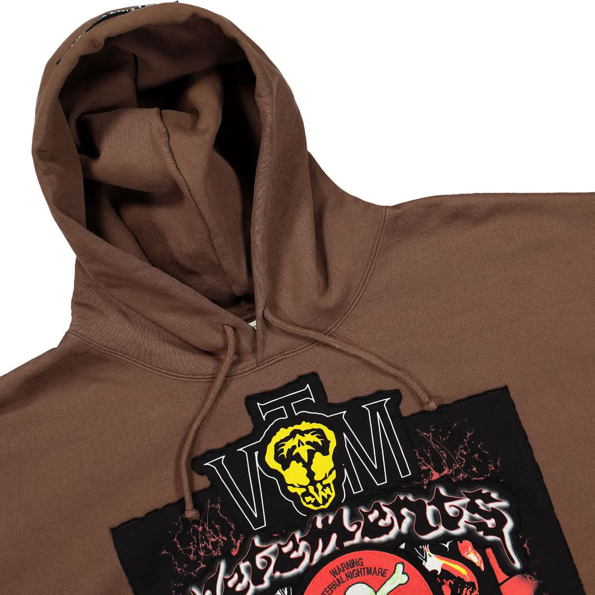 VETEMENTS Metal Patched Logo Hoodie Brown Detail view 5 | Gate