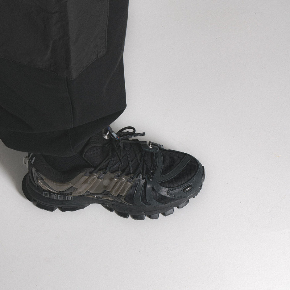 Li Ning Blog Banner Black Sneakers worn with black Pants