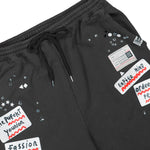Maison Mihara Yasuhiro Embellished Sticker Pant Black sweat & Track Pants A16PT552 Detail View 4 | GATE
