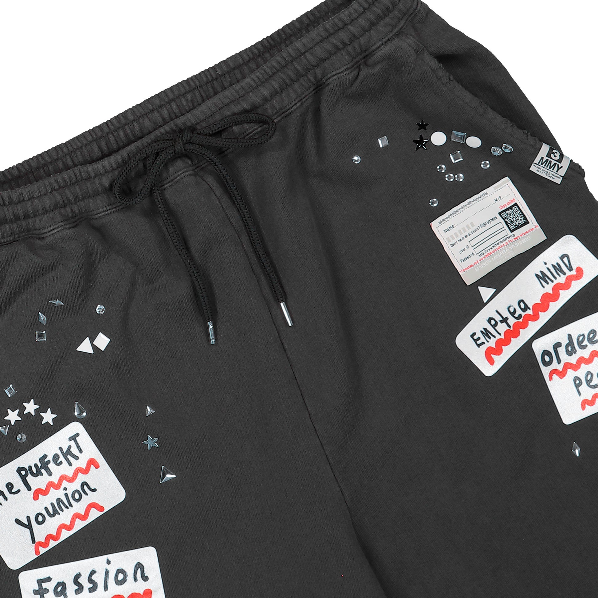 Maison Mihara Yasuhiro Embellished Sticker Pant Black sweat & Track Pants A16PT552 Detail View 4 | GATE
