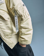 Thug Club x Alpha Industries CWU-45P Rivet Edition  Vintage White Jackets 258150-300 On Model Back View | GATE
