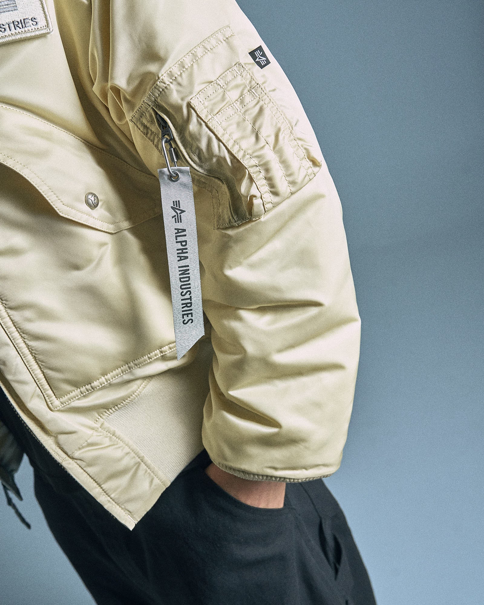 Thug Club x Alpha Industries CWU-45P Rivet Edition  Vintage White Jackets 258150-300 On Model Back View | GATE
