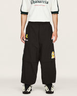 Willy Chavarria x adidas Woven Tracksuit Pant Black    Sweat & Track Pants KU7798 On Model Front View | GATE
