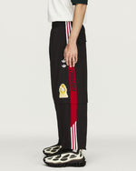 Willy Chavarria x adidas Woven Tracksuit Pant Black    Sweat & Track Pants KU7798 Style Inspiration | GATE
