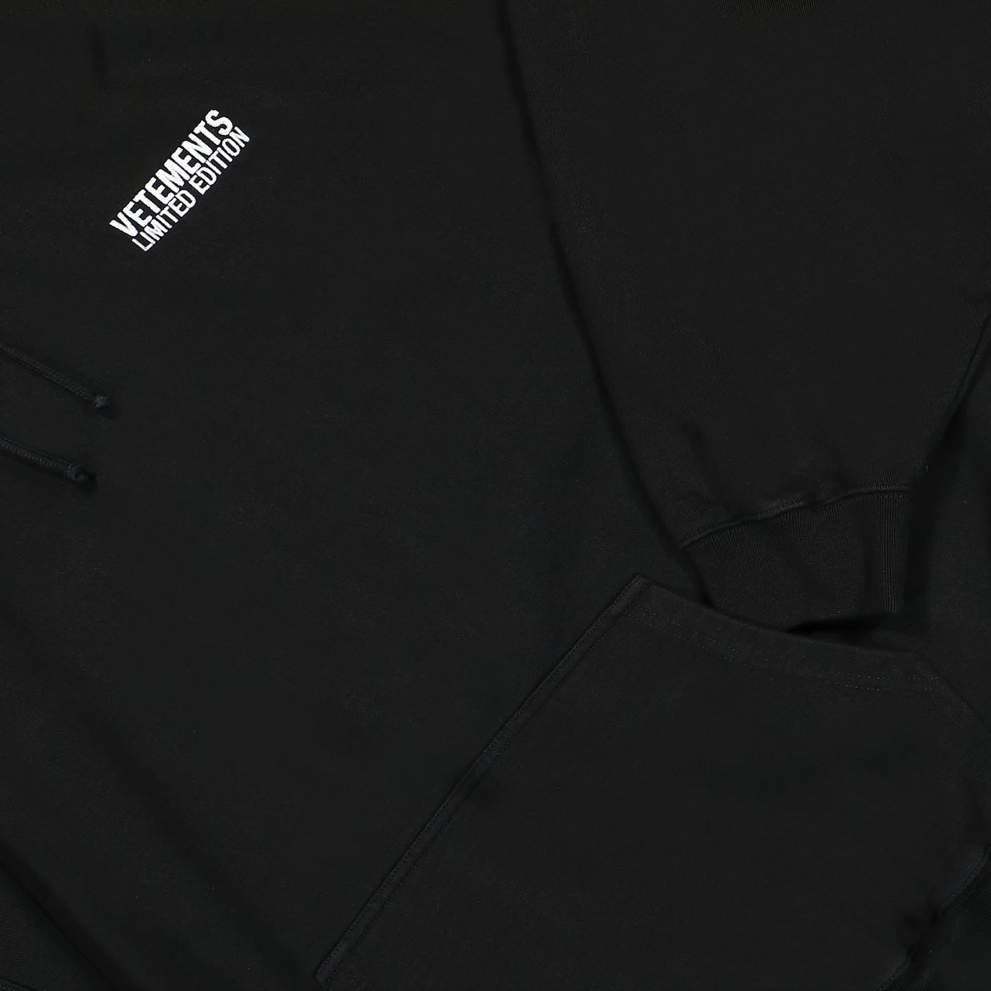 VETEMENTS Embroidered Logo Hoodie Black Detail view 4 | Gate
