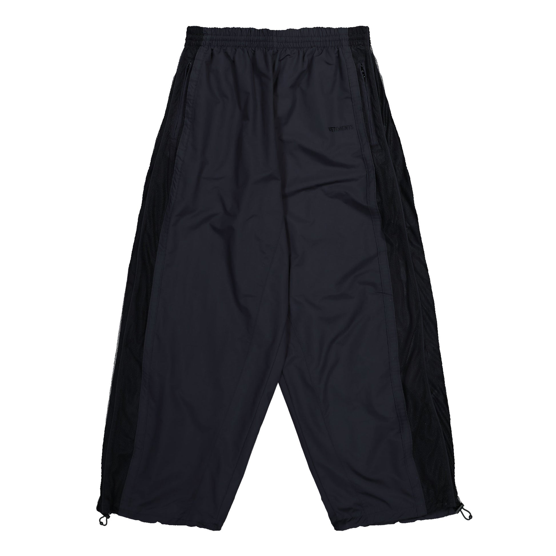 VETEMENTS 50/50 Mesh Pannel Tracksuit Pants Black Sweat & Track Pants UH76GP700B Detail View 1 | GATE
