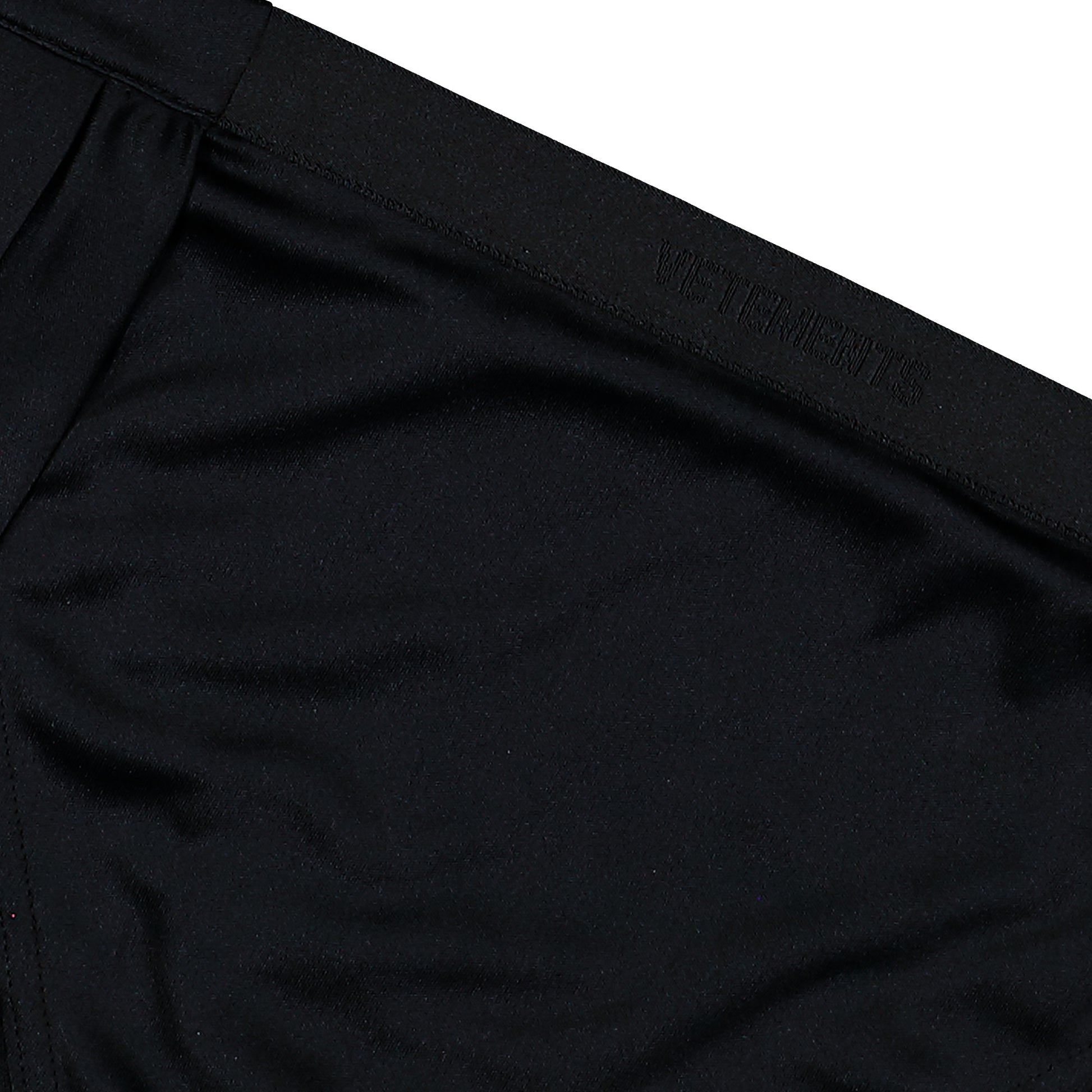 VETEMENTS Open Back Pleated Logo Skirt Black Skirts WE76SK482B Detail View 3 | GATE
